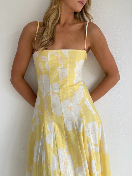 By Nicola Camille maxi dress in amarilla flor floral yellow print with delicate straps, perfect for weddings, summer events and garden parties