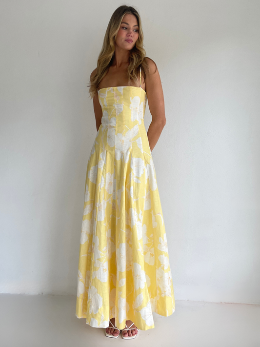 By Nicola Camille maxi dress in amarilla flor floral yellow print with delicate straps, perfect for weddings, summer events and garden parties