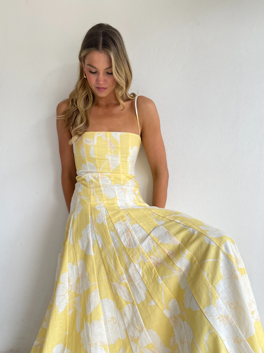 By Nicola Camille maxi dress in amarilla flor floral yellow print with delicate straps, perfect for weddings, summer events and garden parties