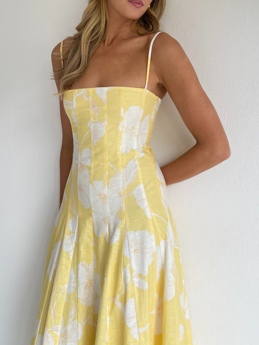 By Nicola Camille maxi dress in amarilla flor floral yellow print with delicate straps, perfect for weddings, summer events and garden parties