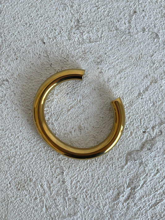 By Nicola Chloe Cuff in Gold