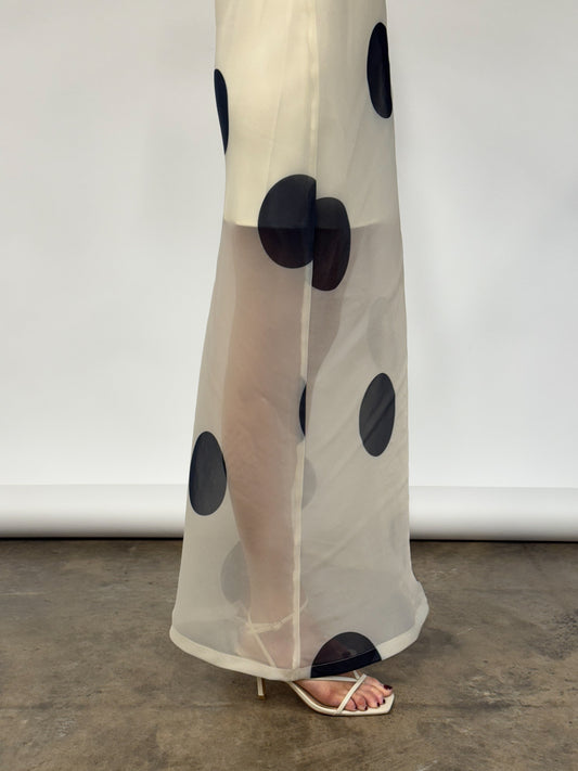 by nicola mila maxi dress in ivory polka Coming Soon: By Nicola Mila Maxi Dress in Ivory Polka This elegant dress features sheer organza adorned with bold polka dots, creating a sleek column silhouette. Its half-lined design and