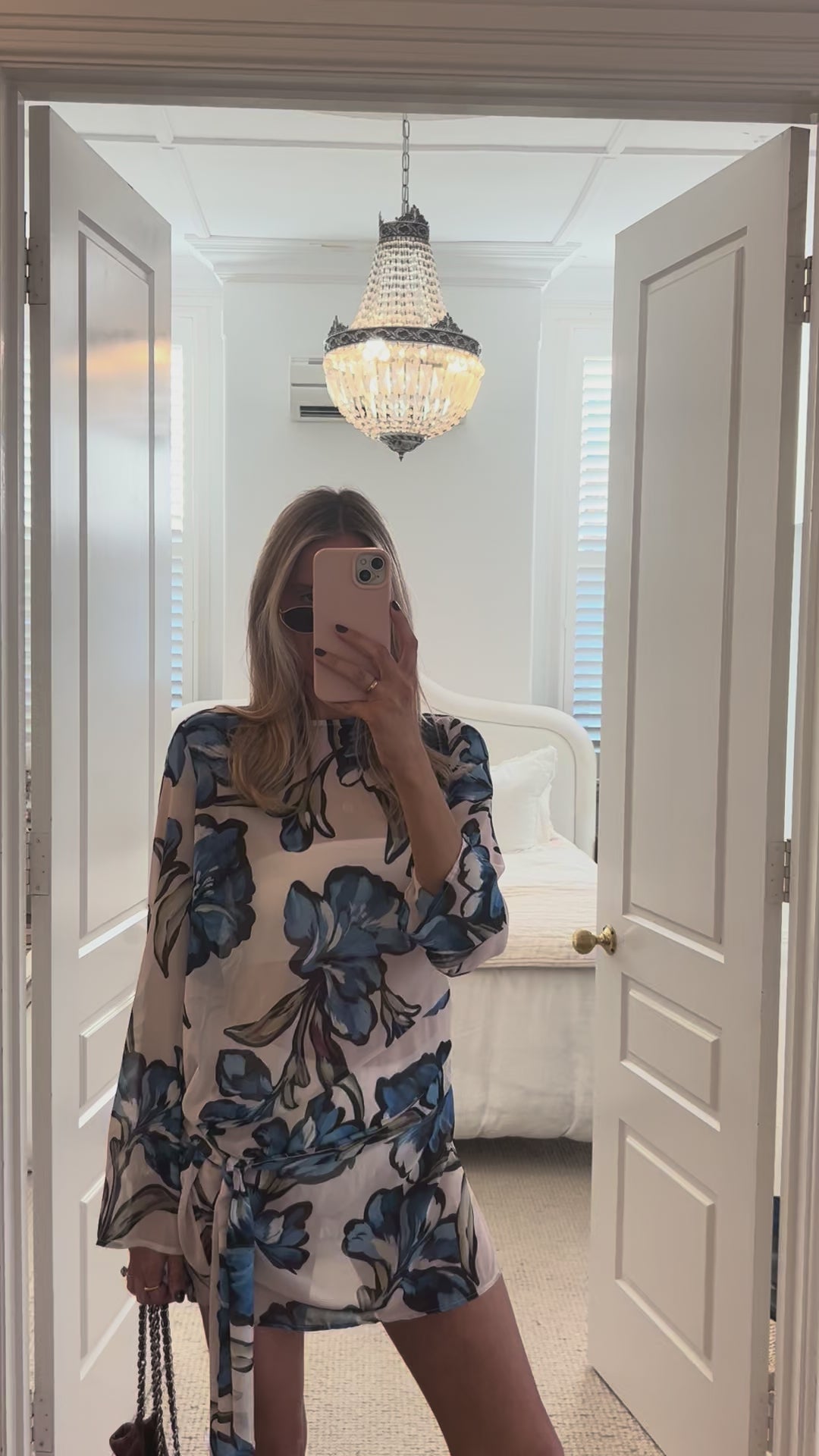 Model wearing BY NICOLA Elodie Mini Dress in Blue Floral with feminine floral print and mini silhouette