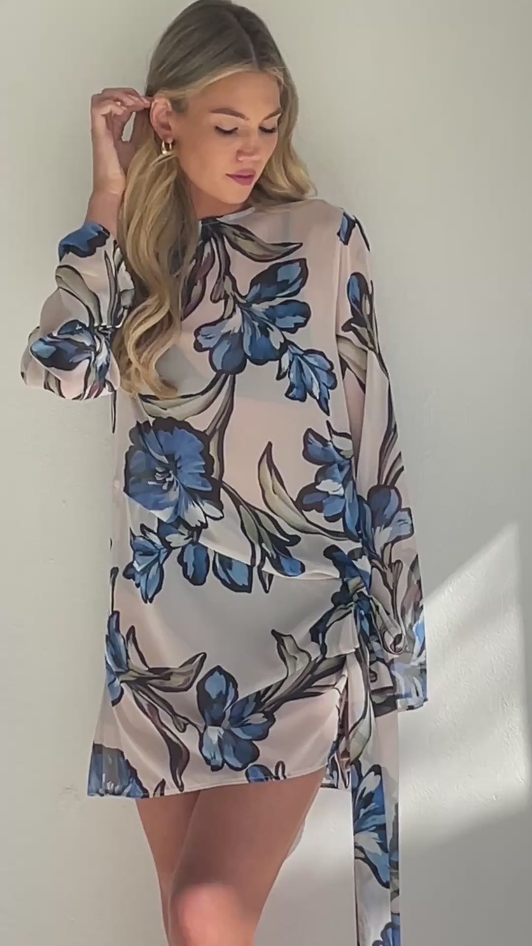 BY NICOLA Elodie Mini Dress in Blue Floral with feminine floral print and mini silhouette